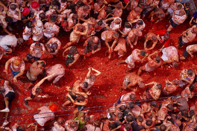 120 tons of overripe tomatoes become projectiles in Spain’s ‘Tomatina’ food fight